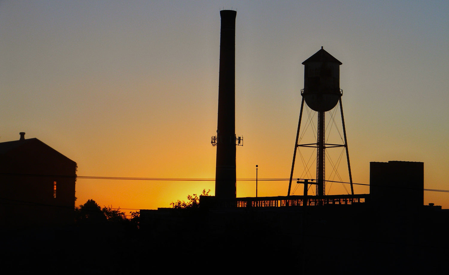 Dead Distillery with Sun Setting Behind It